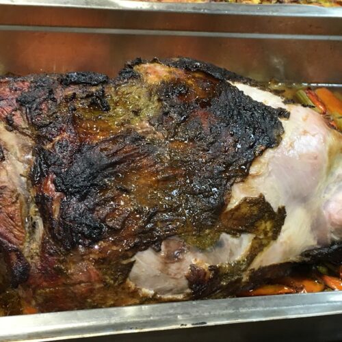 Whole roasted leg of lamb.