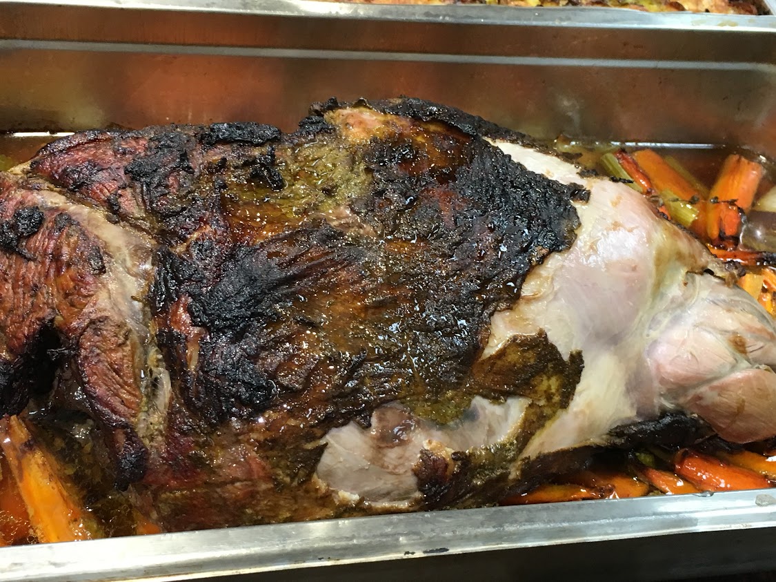 Whole roasted leg of lamb.